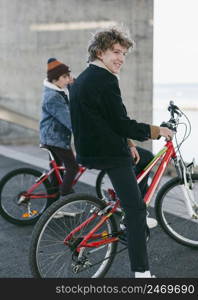 boys outdoors city with their bikes