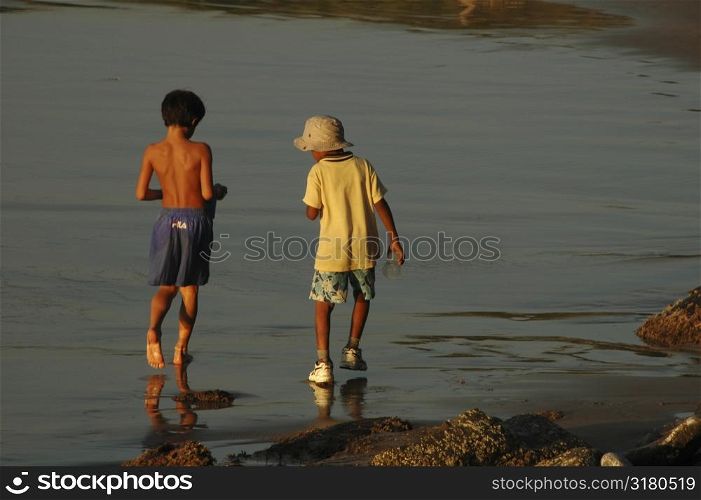 Boys playing at the beach