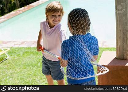 Boys playing with a fishing net