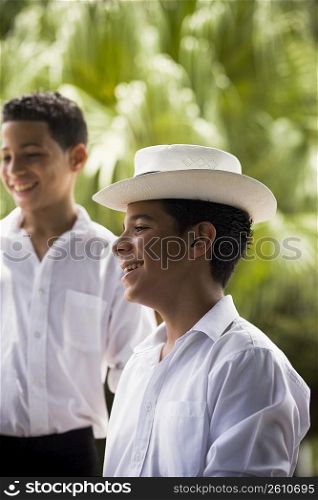 Boys wearing Plena traditional attire, outdoors