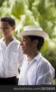Boys wearing Plena traditional attire, outdoors