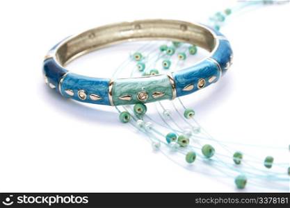 Bracelet and necklace isolated on white background.
