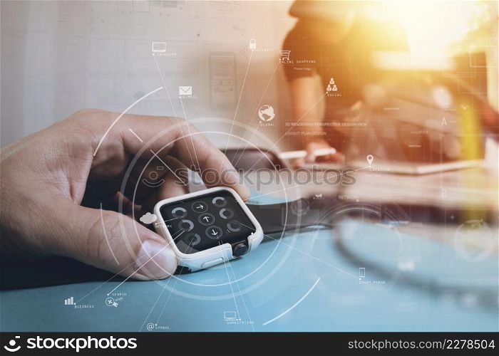 brainstrom teamwork meeting concept,businessman using smart watch and digital tablet and laptop computer in modern office with virtual icon diagram