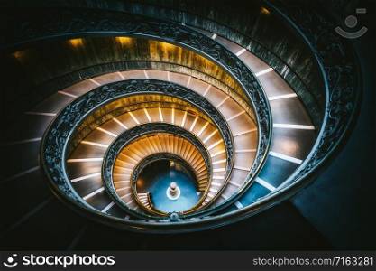 Bramante Staircase in Vatican Museums in the Vatican City , Rome , Italy . The double helix staircase is is the famous travel destination of The Vatican and Rome , Italy.