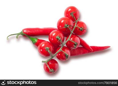 Branch of cherry tomatoes and two red chili peppers isolated on white background
