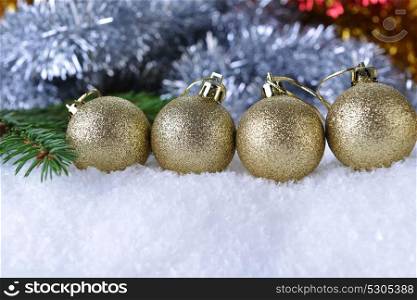 branch of green fir tree with christmas toys on white background