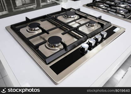 Brand new gas stove. Brand new never used gas stove with stainless tray in appliance retail store