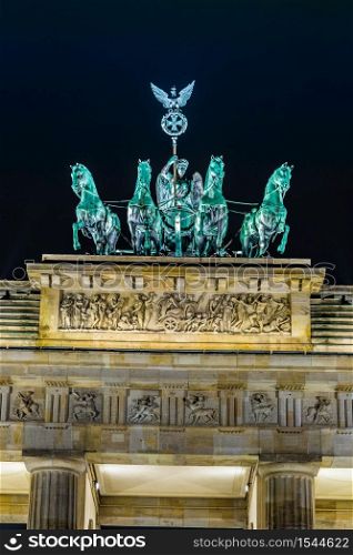 BRANDENBURG GATE, Berlin, Germany at night. Road side view. Brandenburg Gate in Berlin - Germany