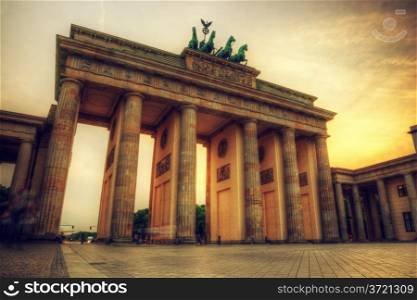 Brandenburg Gate. German Brandenburger Tor in Berlin, Germany. Sunset with beautiful sunbeams