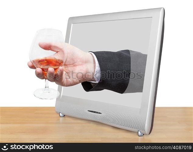 brandy glass in male hand leans out TV screen isolated on white background