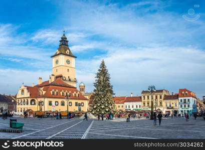 BRASOV, ROMANIA - 01.08.2018. Brasov Town Hall Square in Romania in a sunny winter day at Christmas and New Year holidays. Brasov Town Hall Square in Romania. Brasov Town Hall Square in Romania