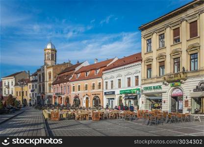 BRASOV, ROMANIA - 01.08.2018. Brasov Town Hall Square in Romania in a sunny winter day at Christmas and New Year holidays. Brasov Town Hall Square in Romania. Brasov Town Hall Square in Romania