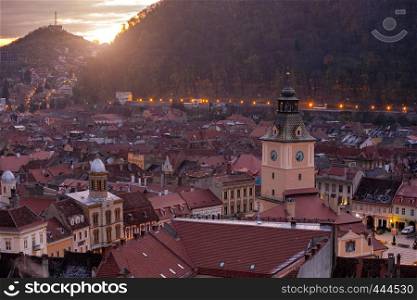 BRASOV, ROMANIA NOVEMBER 1, 2017: view of the main square at the Brasov illuminated by the street lamps. BRASOV, ROMANIA, November 1, 2017