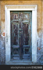 brass brown knocker and wood door in a church crenna gallarate varese italy