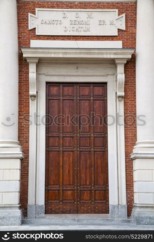 brass brown knocker and wood door in a church crenna gallarate varese italy