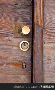 brass brown knocker and wood door vinago varese italy