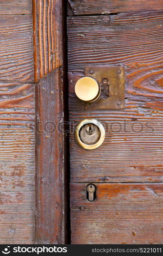 brass brown knocker and wood door vinago varese italy