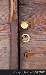 brass brown knocker and wood door vinago varese italy