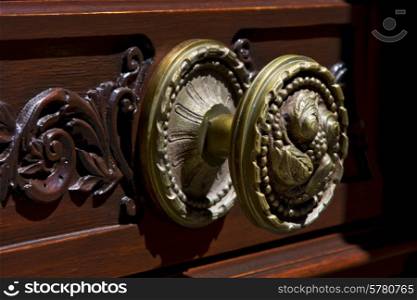 brass brown knocker in a closed wood door colonia del sacramento uruguay