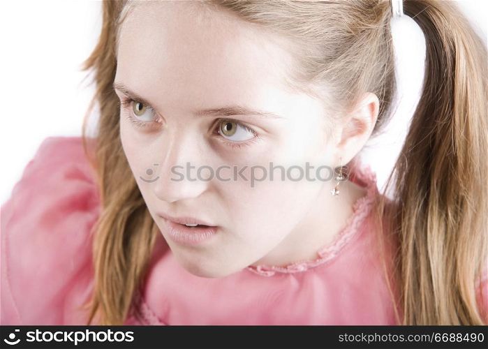 Bratty young girl with a disgusted expression on her face