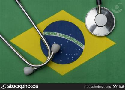 Brazil flag and stethoscope. The concept of medicine. Stethoscope on the flag in the background.. Brazil flag and stethoscope. The concept of medicine.