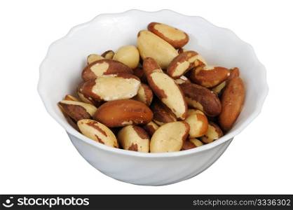 Brazil nut (Bertholletia excelsa) on a white cup on a white background, isolated.