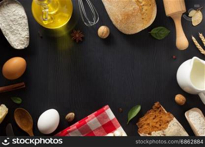 bread and bakery ingredients on wooden background