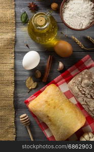 bread and bakery products on wood background