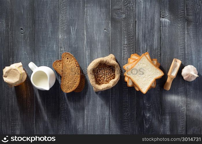 bread and bakery products on wooden background