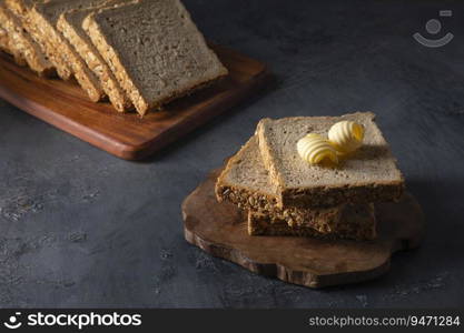 Bread and butter on a black top  table