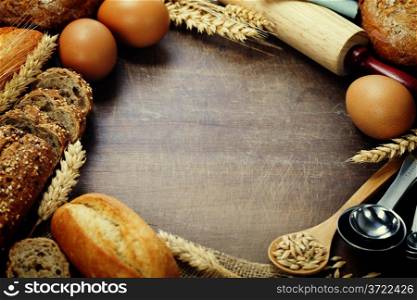 Bread and ingredients frame on wooden table