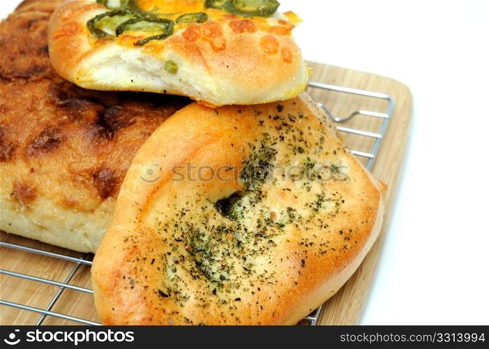 Bread And Rolls. A square loaf of artisan bread and Focaccia rolls in cluding Italian herb and Jalapeno cheddar cheese