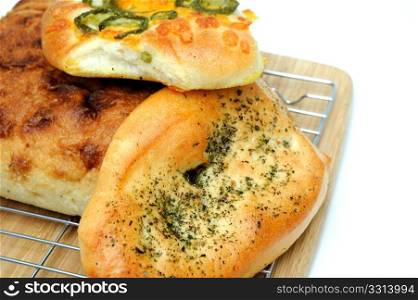 Bread And Rolls. A square loaf of artisan bread and Focaccia rolls in cluding Italian herb and Jalapeno cheddar cheese