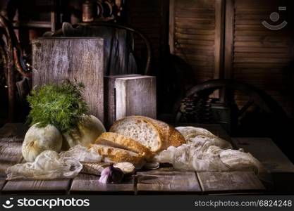 Bread and vegetables on a vintage studio background