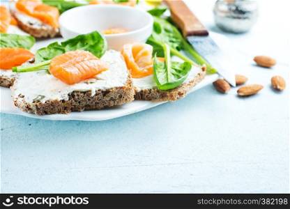 bread, cheese, salmon for breakfast on a table