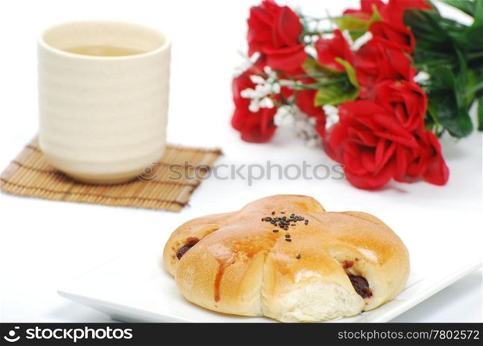 Bread, chinese tea and rose