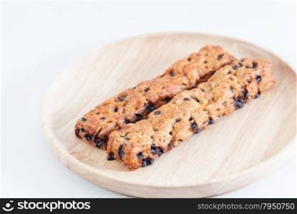 Bread, chocolate. Bread sticks put in place solid wood plate.