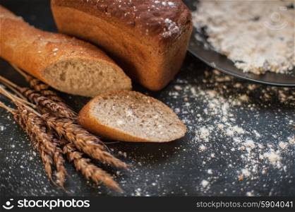 Bread composition . Bread composition with wheats. Very shallow DOF photo and specific art curly bokeh for extra volume.