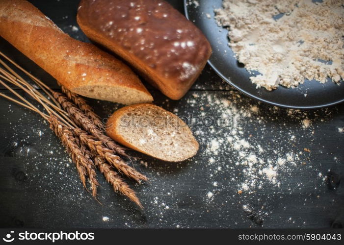 Bread composition . Bread composition with wheats. Very shallow DOF photo and specific art curly bokeh for extra volume.