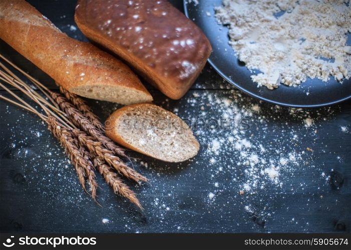 Bread composition . Bread composition with wheats. Very shallow DOF photo and specific art curly bokeh for extra volume.