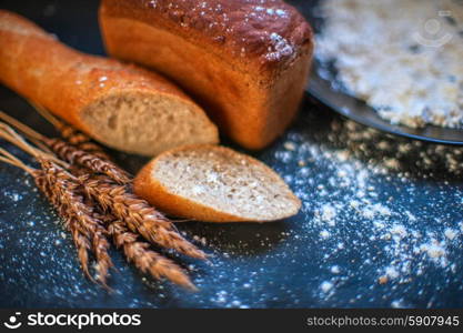 Bread composition . Bread composition with wheats. Very shallow DOF photo and specific art curly bokeh for extra volume.