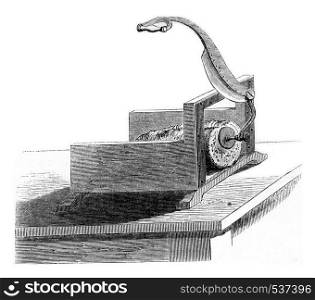 Bread cutting machine, vintage engraved illustration. Magasin Pittoresque 1857.