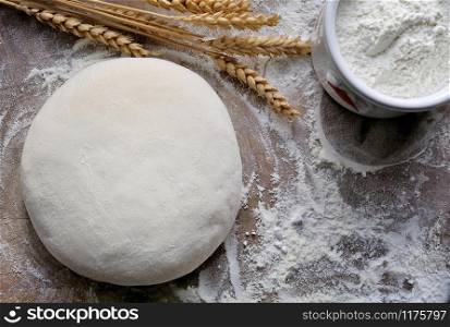 bread dough with wheat on the flour