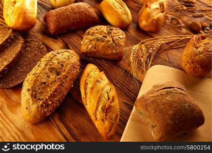 Bread fresh varied mix on golden rustic wood golden table