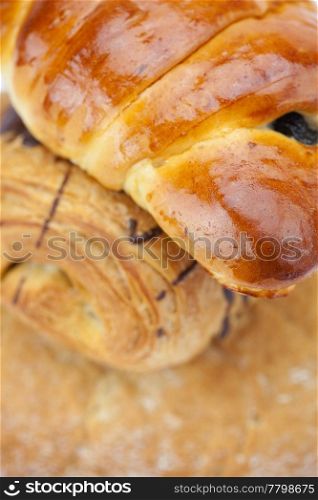 bread, roll with poppy seeds and roll with chocolate isolated on white