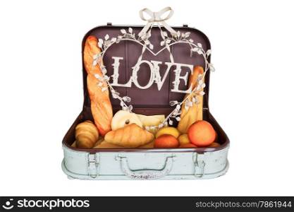 bread set in travel luggage with love on white background