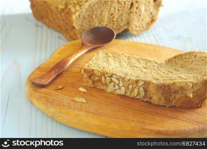 Bread slice organic natural food homemade wholegrain healthy nutrition. Tasty dieting baker meal closeup. Rustical bread on wooden desk oldstyle eating. Selective focus crust piece.