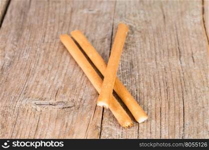 bread sticks grissini on rustic wooden background