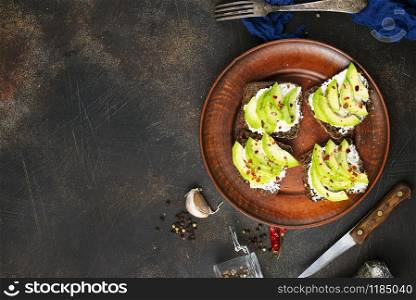 bread with cheese and avocado on a table