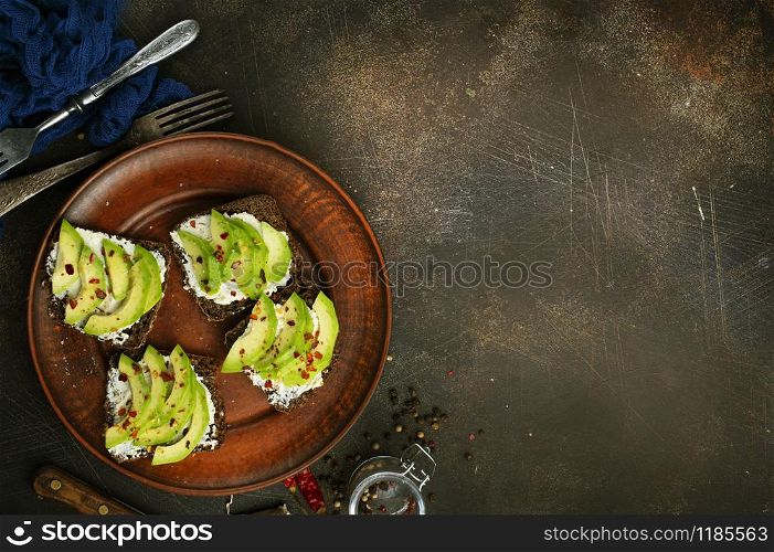 bread with cheese and avocado on a table